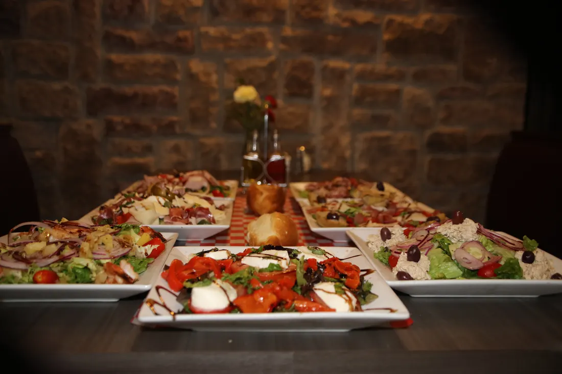 A table of Italian dishes at Little Italy in Northfield